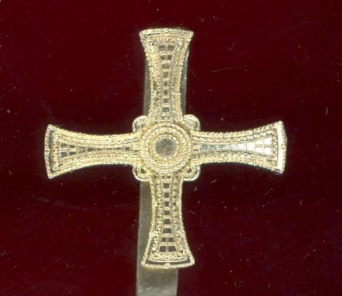 Northumbrian University staybright cap badge